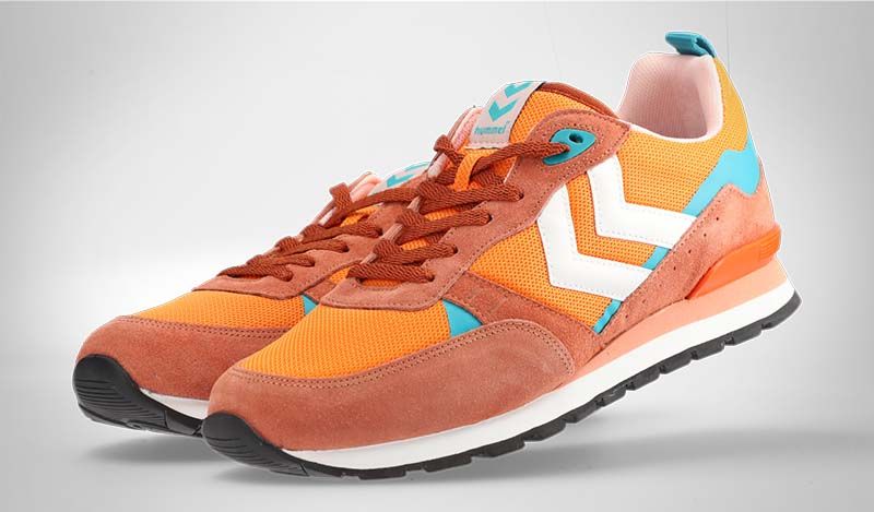 Orangefarbene Schuhe mit ungleichmäßigem Hintergrund durch Vignettierung